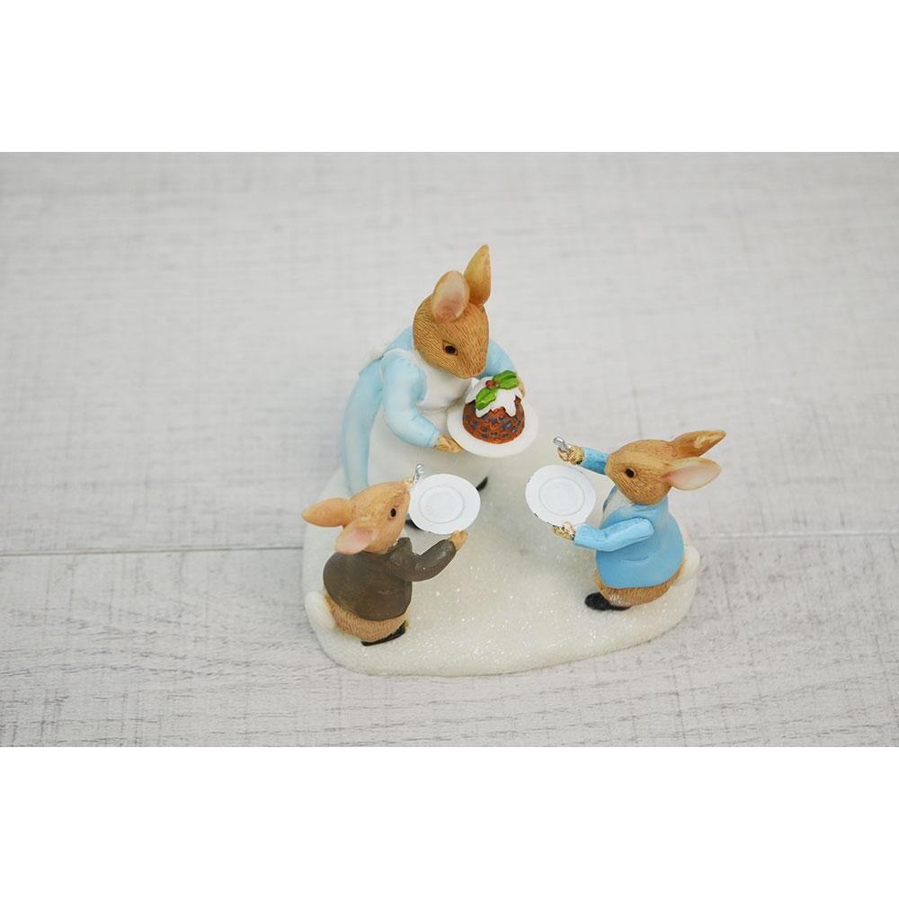 Mrs. Rabbit with a Christmas Pudding Figurine