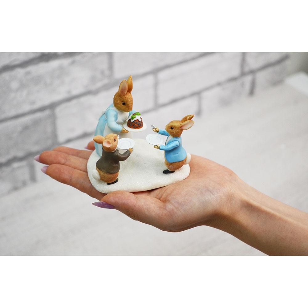 Mrs. Rabbit with a Christmas Pudding Figurine